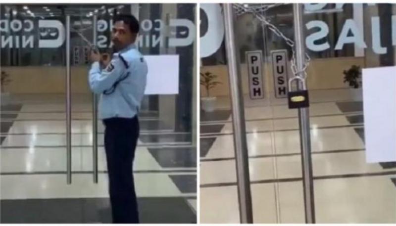 مدير يغلق باب شركته بالسلاسل لمنع موظفيه من المغادرة